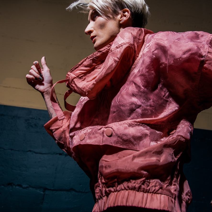 Girl running in pink jacket